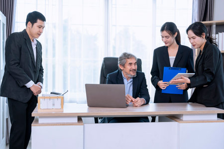 successful senior boss during business meeting,employees having conference in boardroom,conversation,consulting,discussingの写真素材