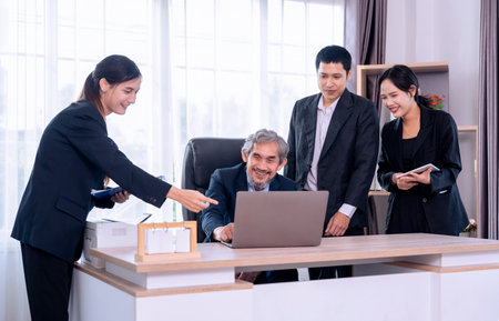 successful senior boss during business meeting,employees having conference in boardroom,conversation,consulting,discussingの写真素材