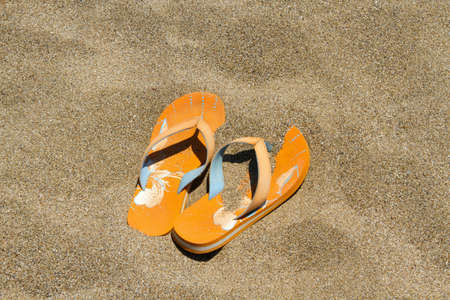 flip flops on the sandの写真素材