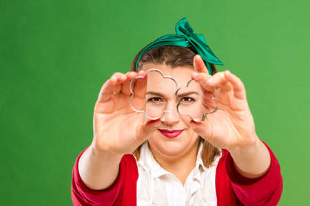 Woman with cookie cuttersの写真素材