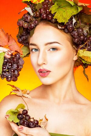 Woman with grapes.の写真素材