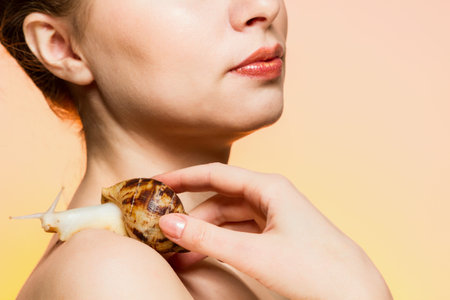 A woman with a snailの写真素材