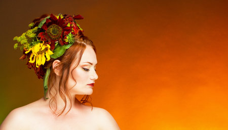 A woman with hair decorated with flowers.の写真素材