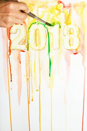 That person is paints with watercolor paint around 2018.の写真素材