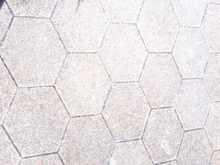 The road is covered with paving slabs.