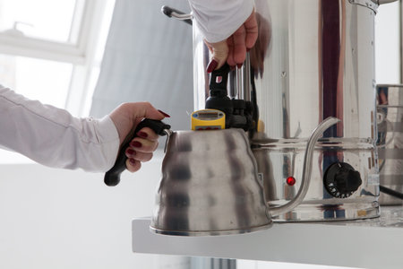 Man pours water.の写真素材