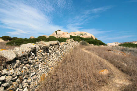a stonewall at the coast of north sardiniaの写真素材