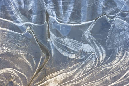 Ice on the surface of a little pondの写真素材