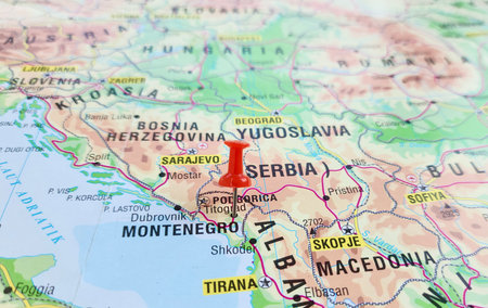 View of Montenegro ,is a country in Southeast Europe, on the Balkan Peninsula, on a geographical map of Europe, marked with red push pinの写真素材