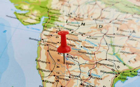 View of Bijapur, is the district headquarters of Bijapur district of the Karnataka state of India, on a geographical map of Asia, marked with red pushpinの写真素材