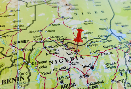 View of Kano, is a city in northern Nigeria and the capital of Kano State, on a geographical map of Africa, marked with red pushpinの写真素材