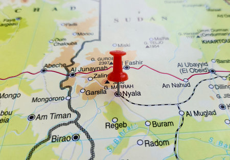 View of Nyala, is a city and the capital of the state of South Darfur in the south-west of Sudan, on a geographical map of Africa, marked with red pushpinの写真素材