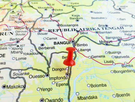 View of Impfondo, is a town and a commune in the northeastern Republic of the Congo lying on the Oubangui River, on a geographical map of Africa, marked with red pushpinの写真素材
