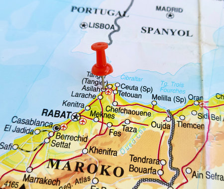 View of Asilah, is a fortified town on the northwest tip of the Atlantic coast of Morocco, on a geographical map of Africa, marked with red pushpinの写真素材