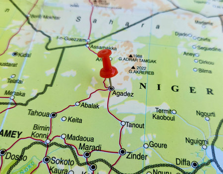 View of Agadez, formerly spelled Agades, is the fifth largest city in Niger, on a geographical map of Africa, marked with red pushpinの写真素材