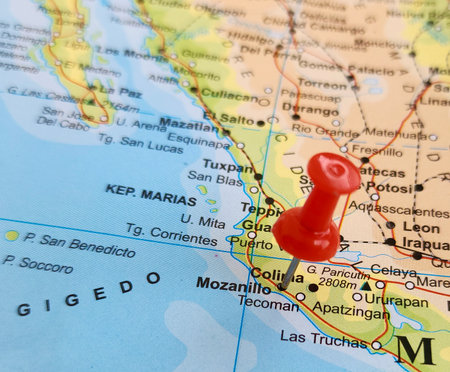 View of Manzanillo, is the most populous city in the Mexican state of Colima, on a geographical map of America, marked with red pushpinの写真素材