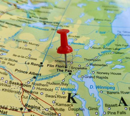 View of Flin Flon, is a mining city, City in Manitoba and Saskatchewan, Canada, on a geographical map of America, marked with red pushpinの写真素材