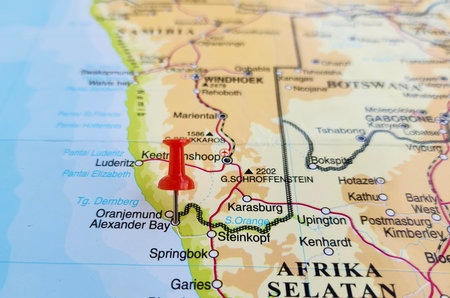View of Alexander Bay, is a town in the extreme north-west of South Africa, on a geographical map of Africa, marked with red pushpinの写真素材