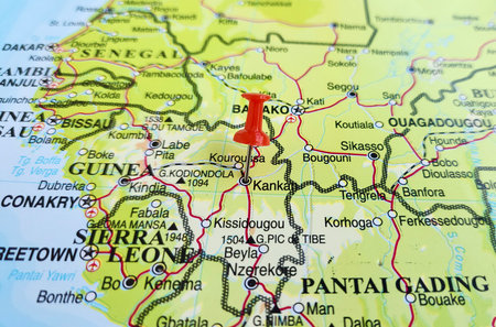 View of Kankan, is the largest city in Guinea in land area, and the third largest in population, on a geographical map of Africa, marked with red pushpinの写真素材