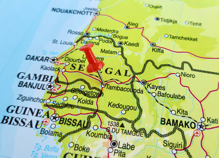 View of Tambacounda, is the largest city in eastern Senegal, on a geographical map of Africa, marked with red pushpinの写真素材