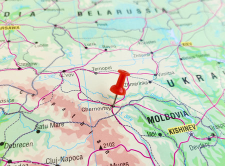 View of Chernivtsi, Capital city of Chernivtsi Oblast in western Ukraine and historical center of the Bukovina, on a geographical map of Europe, marked with red pushpinの写真素材