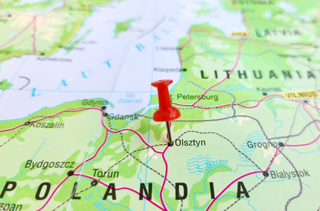 View of Olsztyn, is the capital of the Warmian-Masurian Voivodeship, Poland, on a geographical map of Europa, marked with red pushpinの写真素材