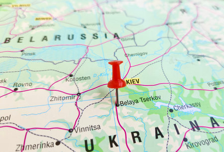 View of Bila Tserkva, City in Kyiv Oblast, Central Ukraine, on a geographical map of Europa, marked with red pushpinの写真素材