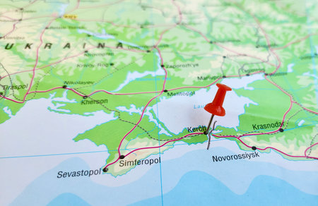 View of Kerch, also known as Kerich, is a city of on the Kerch Peninsula in the east of Crimea, Ukraine, on a geographical map of Europa, marked with red pushpinの写真素材