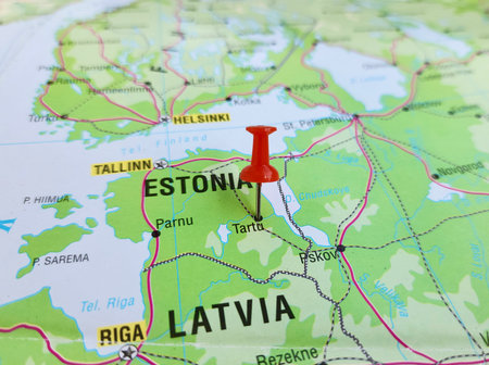 View of Tartu, is the second largest city in Estonia after Tallinn, on a geographical map of Europe, marked with red pushpinの写真素材