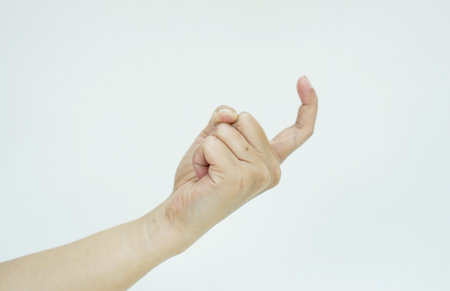 women's hand calling gesture isolated on white backgroundの写真素材