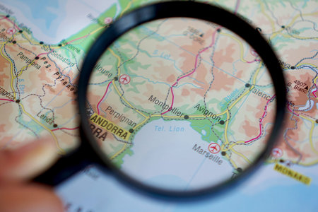 view of Montpellier, France on a geographical map with a magnifying glass