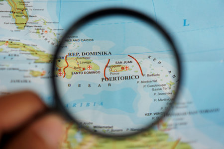 view of Puerto Rico, Unincorporated territory of the United States of America on a geographic map, seen using a magnifying glassの写真素材