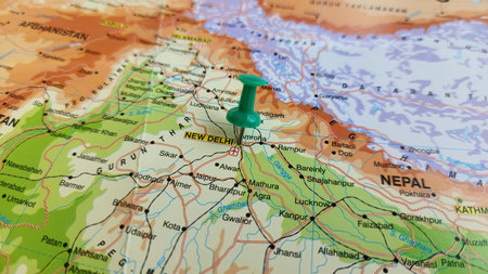 view of New Delhi, the capital of India and a part of the National Capital Territory of Delhi, on a geographical map of Asia, marked with green push pinの写真素材