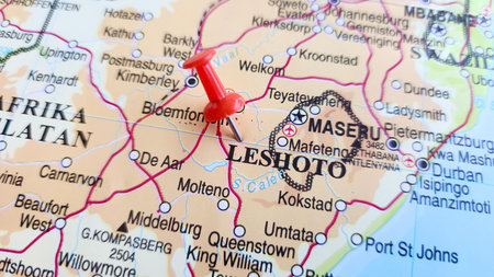 View of Lesotho, formally the Kingdom of Lesotho and formerly known as Basutoland, is a landlocked country in Southern Africa, on a geographical map of Africa, marked with red pinの写真素材