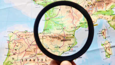 View of Andorra, Country in Europe, on a geographical map of Europe, seen using a magnifying glassの写真素材