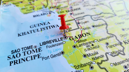 View of Libreville, is the capital and largest city of Gabon, located on the Gabon Estuary, on a geographical map of Africa, marked with red push pinの写真素材