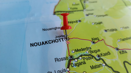 View of Nouakchott, is the capital and largest city of Mauritania, on a geographical map of Africa, marked with red push pinの写真素材