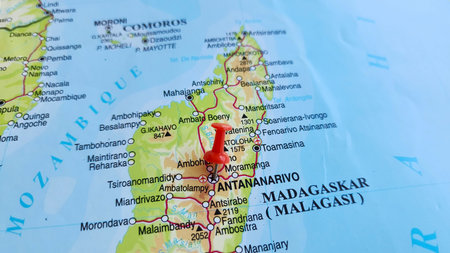 View of Antananarivo, also known by its colonial shorthand form Tana, is the capital and largest city of Madagascar, on a geographical map of Africa, marked with red push pinの写真素材
