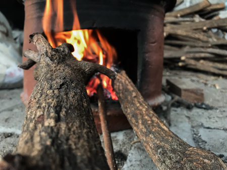 Burning wood in the stove, close-up of firewoodの写真素材