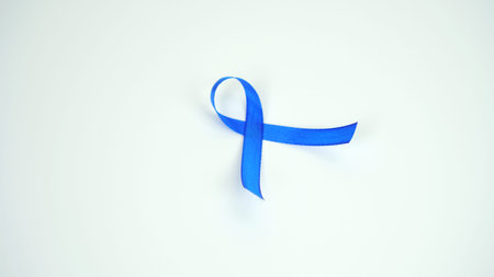 blue ribbon which means symbolizing support for prostate cancer, isolated on white background