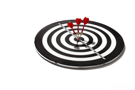 red darts smack in the center of the board 