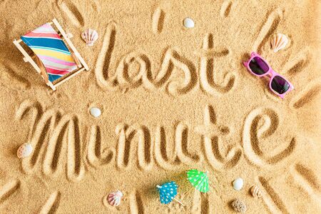 Last minute vacation (holiday) - travel agency poster concept. Colorful wooden deck chair and pink sunglasses on the golden sand. Summer beach from above (top view, flat lay).の写真素材