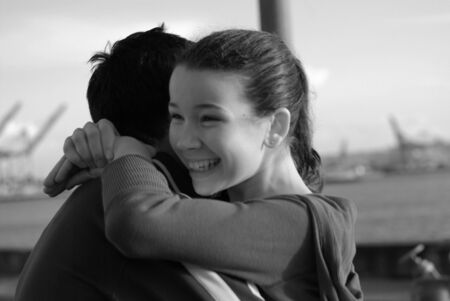 young girl hugs fatherの写真素材