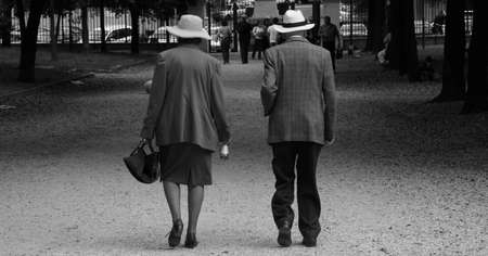 old couple walking in a parkの写真素材