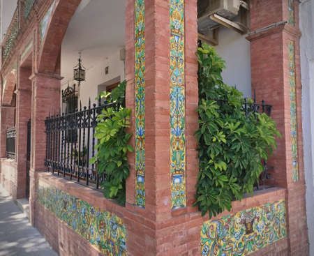 Brickhouse in old town of Priego de CÃ³rdoba Andalusia Spain with green plants beautiful tilesの写真素材
