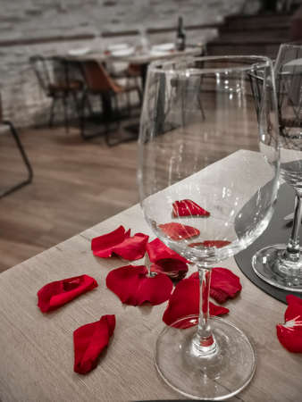 Well decorated romantic ValentineÂ´s day dinner with rose petalsの写真素材