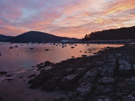 Cedeira, Galicia, Spain - Amazing sunset at the port. Beautiful warm colors of the sky