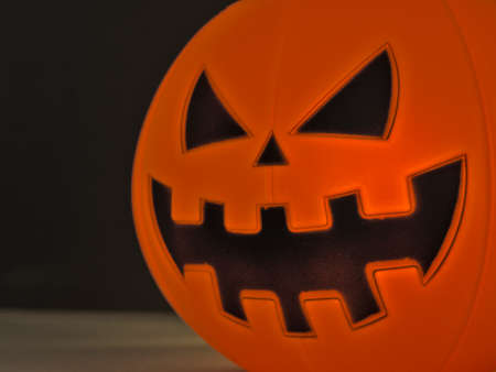 Close up view of scary Halloween pumpkin lantern for halloween party night with black background. Selective focusの写真素材