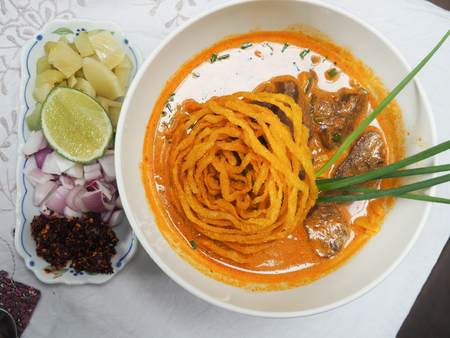 Khao Soi (in Thai) or curried noodle soup with beef, traditional food of Northern Thailandの写真素材