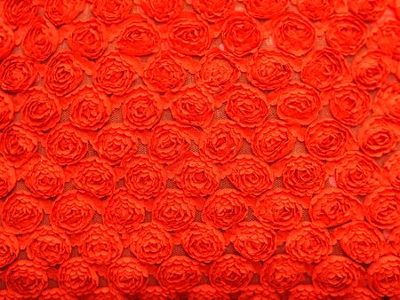 Red fabric texture of roses.の写真素材